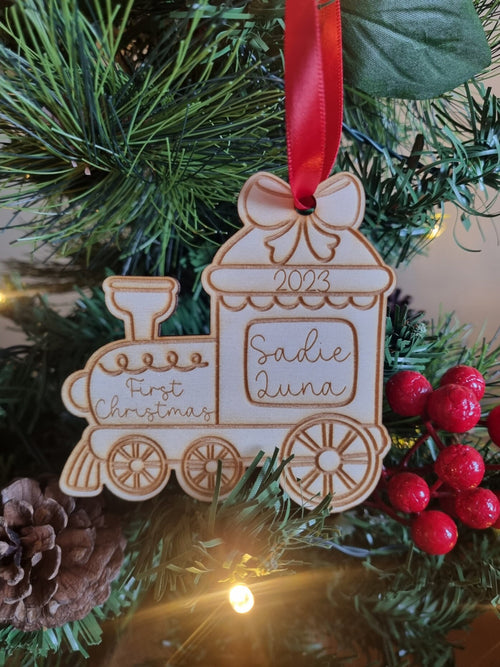Personalised Christmas Tree Ornament made from poplar ply wood. It has been laser cut and engraved in the shape of a christmas train.