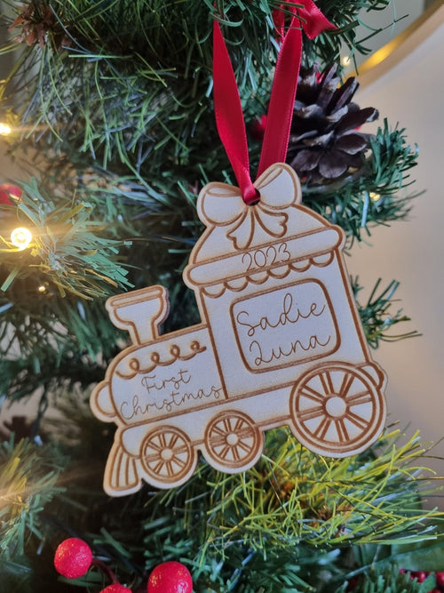 Personalised Christmas Tree Ornament made from poplar ply wood. It has been laser cut and engraved in the shape of a christmas train.